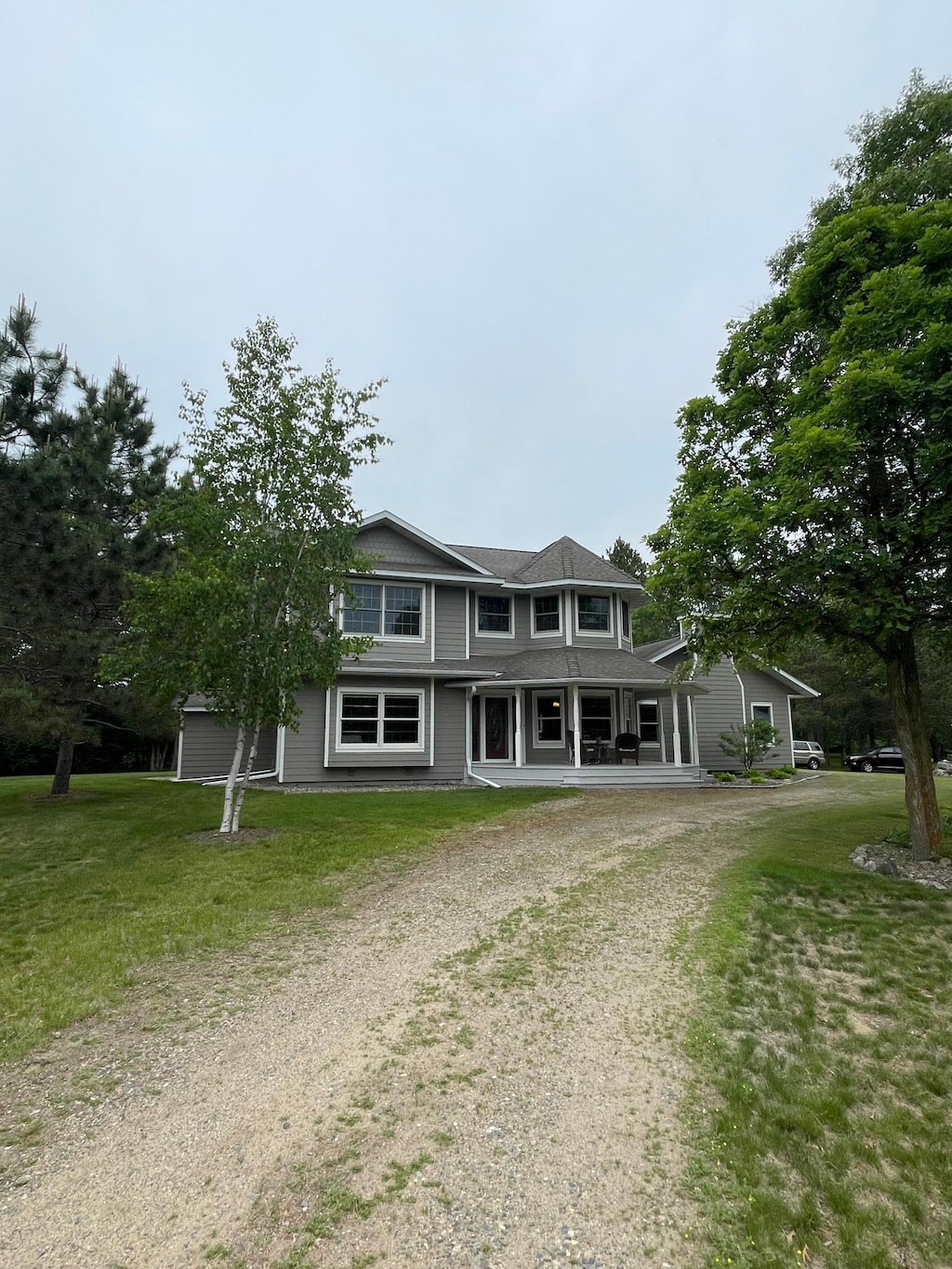 1764 State 84 SW, Pine River, MN 56474 - view of front of home featuring dirt driveway, covered porch, and a front lawn