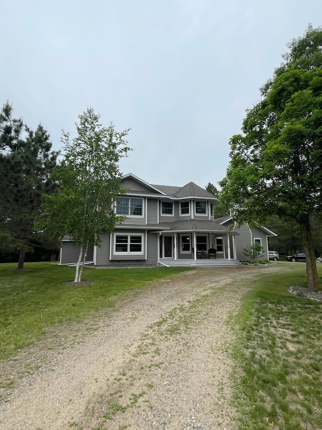 1764 State 84 SW, Pine River, MN 56474 - view of front of home featuring dirt driveway, covered porch, and a front lawn