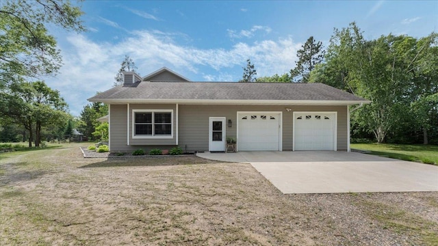 1764 State 84 SW, Pine River, MN 56474 - view of front of home with concrete driveway, a garage, a chimney, roof with shingles, and a front lawn