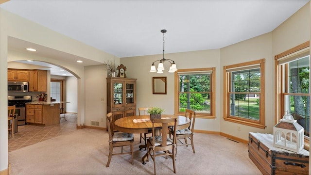 1764 State 84 SW, Pine River, MN 56474 - dining area featuring arched walkways, light carpet, a chandelier, and recessed lighting