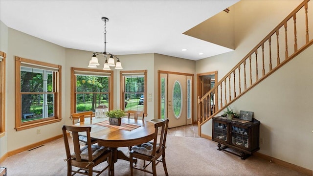 1764 State 84 SW, Pine River, MN 56474 - dining space featuring light colored carpet, a chandelier, stairway, and recessed lighting