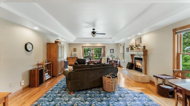 1764 State 84 SW, Pine River, MN 56474 - living room with a ceiling fan, a fireplace, light wood-style flooring, a raised ceiling, and recessed lighting