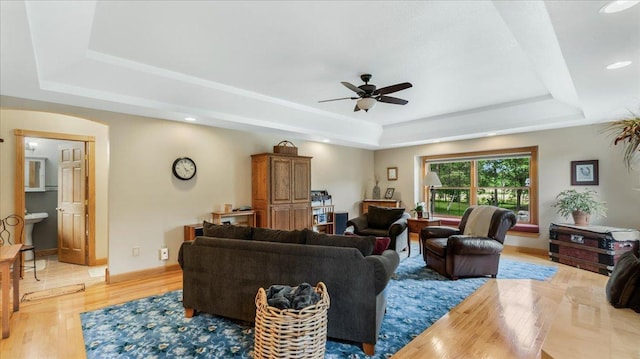 1764 State 84 SW, Pine River, MN 56474 - living area with a raised ceiling, a ceiling fan, light wood finished floors, arched walkways, and recessed lighting