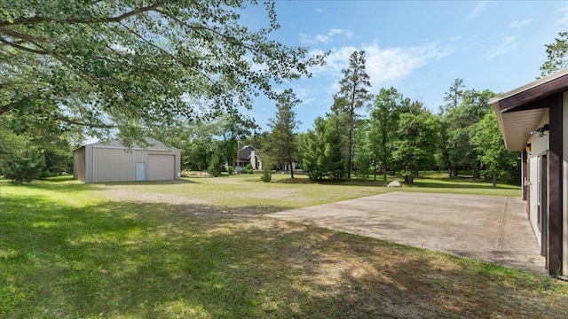 1764 State 84 SW, Pine River, MN 56474 - view of grassy yard featuring an outbuilding, a garage, and view of scattered trees