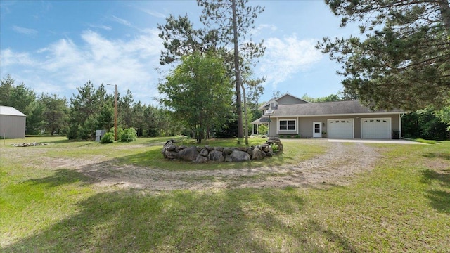 1764 State 84 SW, Pine River, MN 56474 - view of grassy yard with driveway and a garage