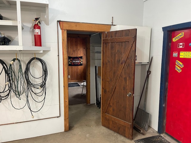 1764 State 84 SW, Pine River, MN 56474 - garage view of concrete flooring and a fire extinguisher