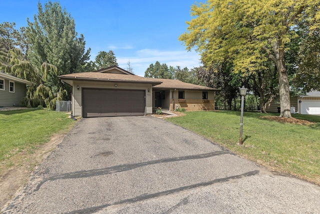 755 Keokuk Ln, Mendota Heights, MN 55120 - ranch-style house featuring a garage, driveway, a front yard, and a shingled roof