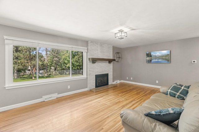 755 Keokuk Ln, Mendota Heights, MN 55120 - living area with wood finished floors and a fireplace