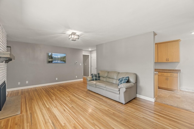 755 Keokuk Ln, Mendota Heights, MN 55120 - living room featuring light wood-style flooring and a fireplace