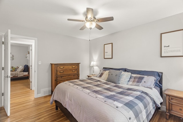 755 Keokuk Ln, Mendota Heights, MN 55120 - bedroom with light wood-style flooring and ceiling fan