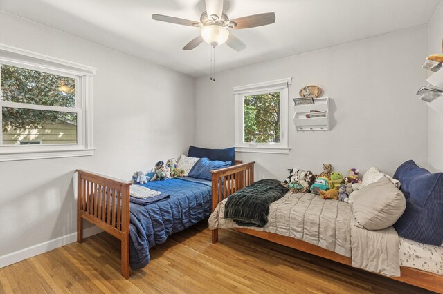 755 Keokuk Ln, Mendota Heights, MN 55120 - bedroom with wood finished floors and a ceiling fan