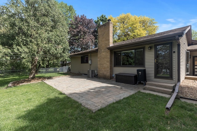 755 Keokuk Ln, Mendota Heights, MN 55120 - rear view of house featuring a chimney, a patio, and entry steps