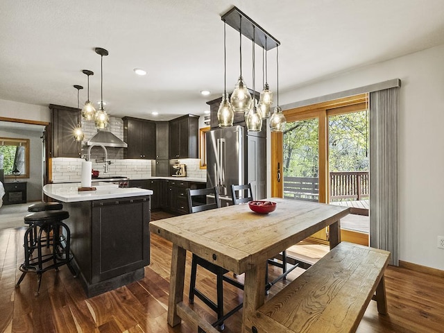 25533 Heritage Ln, Wyoming, MN 55092 - kitchen featuring freestanding refrigerator, light countertops, backsplash, dark wood-style flooring, and recessed lighting