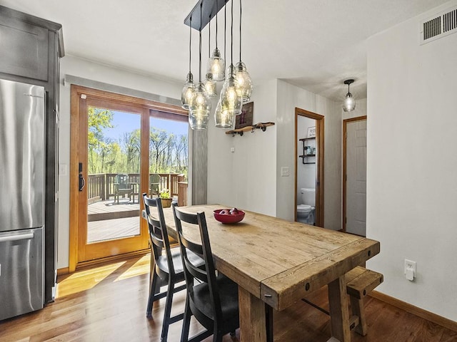 25533 Heritage Ln, Wyoming, MN 55092 - dining space featuring light wood-style floors and baseboards