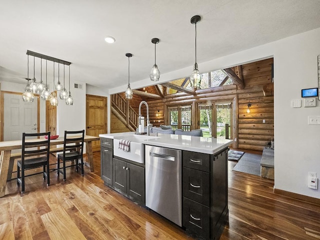 25533 Heritage Ln, Wyoming, MN 55092 - kitchen with dishwasher, rustic walls, wood finished floors, light countertops, and decorative light fixtures