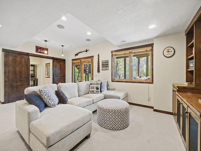 25533 Heritage Ln, Wyoming, MN 55092 - living room featuring light colored carpet, recessed lighting, a textured ceiling, and a barn door