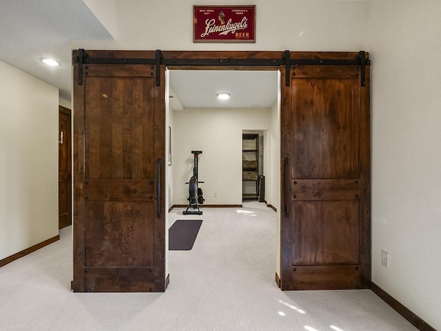 25533 Heritage Ln, Wyoming, MN 55092 - hallway with a barn door, carpet floors, and recessed lighting