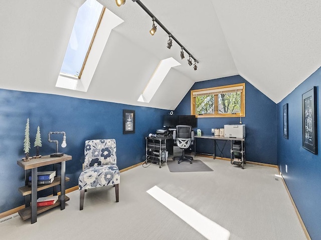 25533 Heritage Ln, Wyoming, MN 55092 - carpeted home office featuring rail lighting, a skylight, and vaulted ceiling