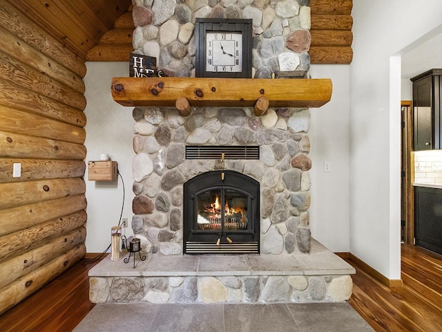 25533 Heritage Ln, Wyoming, MN 55092 - detailed view of log walls, wood finished floors, a fireplace, and wooden ceiling