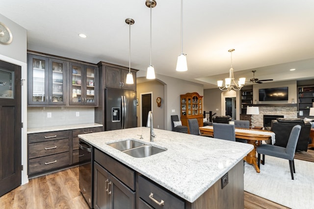 2745 Sand Trap Rd SE, Rochester, MN 55904 - kitchen with fridge with ice dispenser, dishwasher, dark brown cabinets, wood finished floors, and recessed lighting