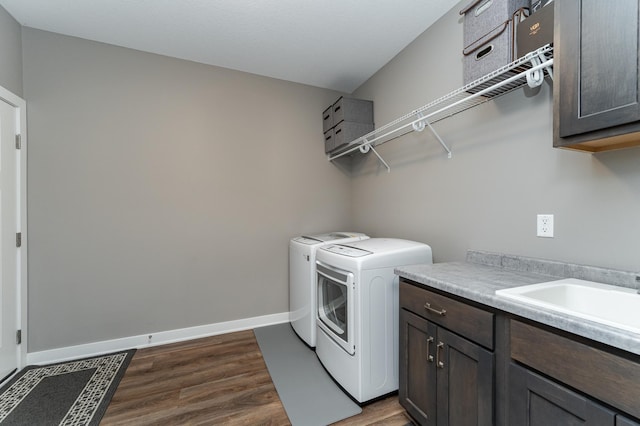 2745 Sand Trap Rd SE, Rochester, MN 55904 - washroom featuring cabinet space, washing machine and dryer, and dark wood-style flooring