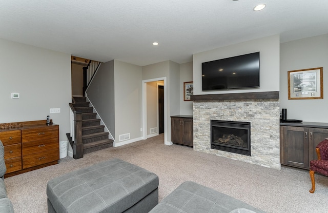 2745 Sand Trap Rd SE, Rochester, MN 55904 - living room featuring carpet floors, stairway, recessed lighting, and a fireplace