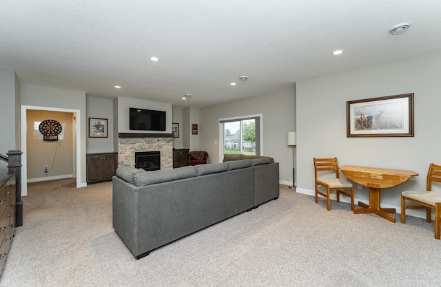2745 Sand Trap Rd SE, Rochester, MN 55904 - living area with light colored carpet, a stone fireplace, and recessed lighting