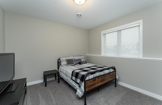 2745 Sand Trap Rd SE, Rochester, MN 55904 - bedroom featuring dark carpet and baseboards