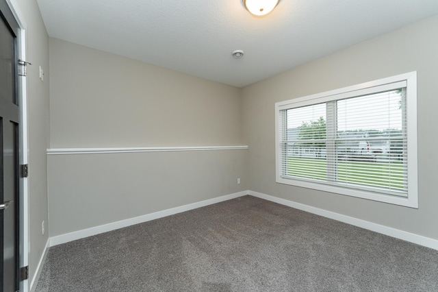 2745 Sand Trap Rd SE, Rochester, MN 55904 - unfurnished room featuring dark carpet and baseboards