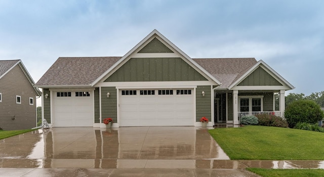 2745 Sand Trap Rd SE, Rochester, MN 55904 - craftsman inspired home with board and batten siding, a garage, a shingled roof, concrete driveway, and a front lawn