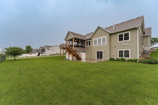 2745 Sand Trap Rd SE, Rochester, MN 55904 - rear view of property featuring stairs, a sunroom, roof with shingles, and a wooden deck