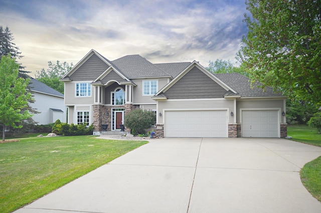 8051 Enclave Bay, Woodbury, MN 55125 - craftsman-style home featuring concrete driveway, an attached garage, stone siding, and a front lawn