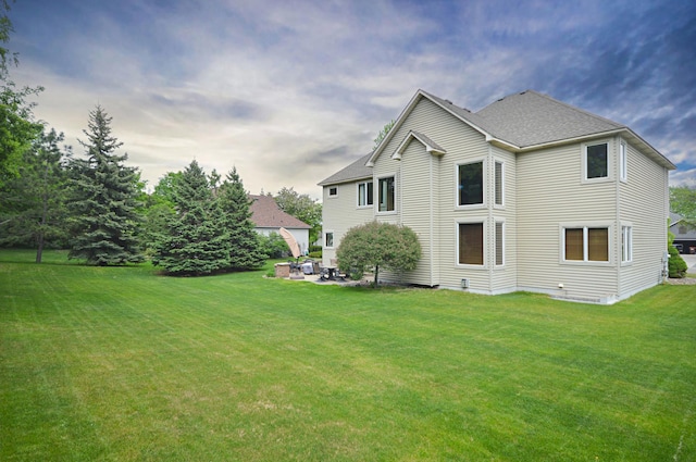 8051 Enclave Bay, Woodbury, MN 55125 - rear view of property with a yard, a patio, and a shingled roof