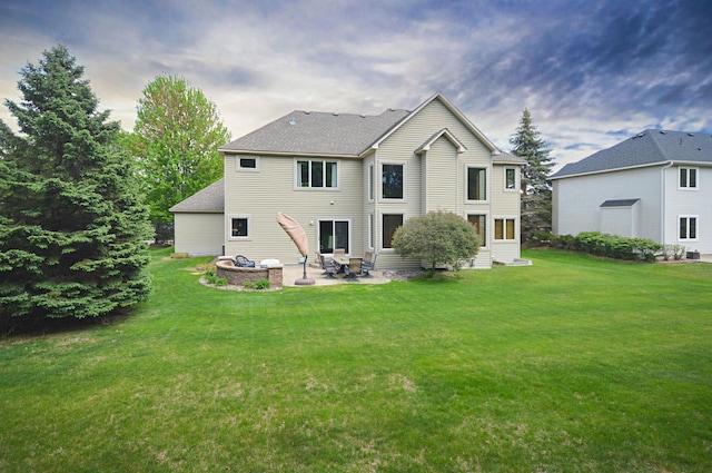 8051 Enclave Bay, Woodbury, MN 55125 - rear view of property featuring a patio area, a lawn, entry steps, and a shingled roof