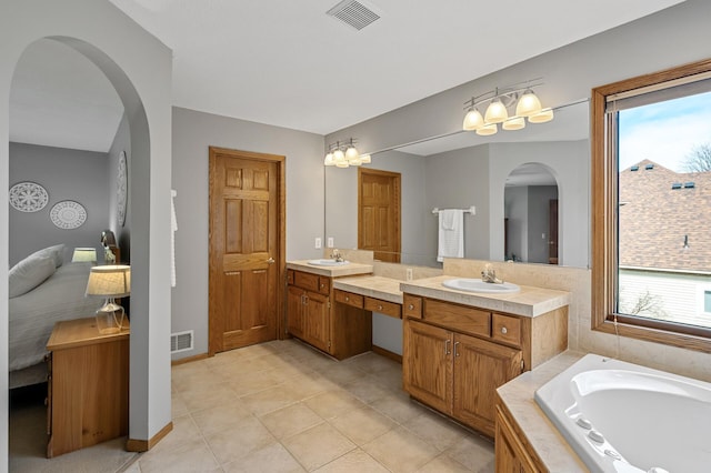 8051 Enclave Bay, Woodbury, MN 55125 - full bathroom with vanity, a garden tub, and tile patterned flooring