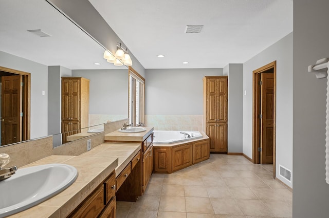 8051 Enclave Bay, Woodbury, MN 55125 - bathroom with a bath, double vanity, tile patterned flooring, and recessed lighting