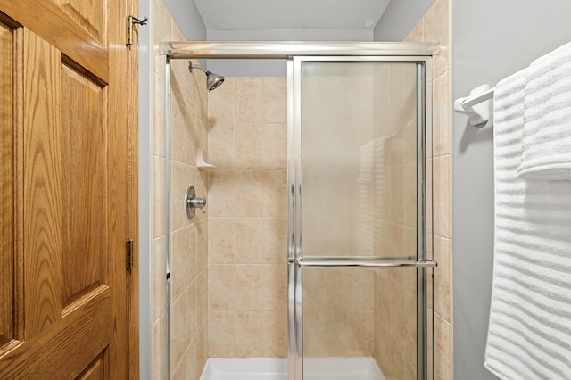 8051 Enclave Bay, Woodbury, MN 55125 - full bathroom featuring a stall shower