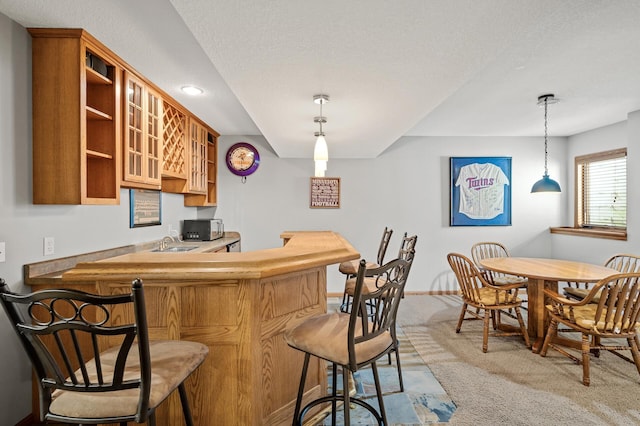 8051 Enclave Bay, Woodbury, MN 55125 - indoor dry bar featuring light carpet, pendant lighting, stainless steel microwave, a textured ceiling, and recessed lighting