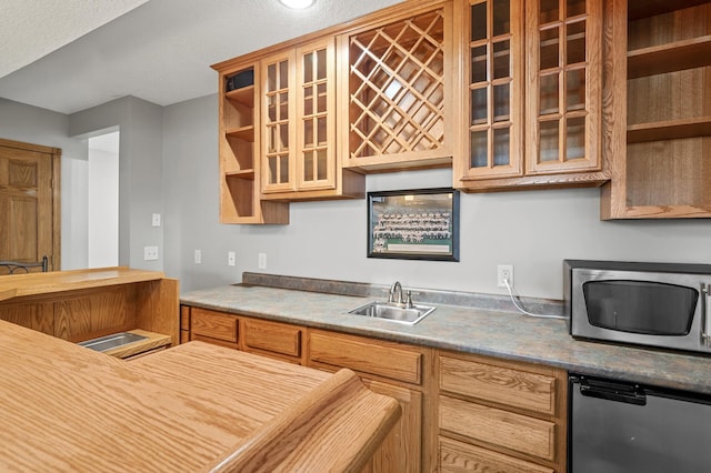 8051 Enclave Bay, Woodbury, MN 55125 - kitchen featuring stainless steel appliances and glass insert cabinets