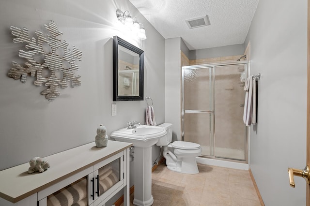 8051 Enclave Bay, Woodbury, MN 55125 - bathroom with a shower stall, tile patterned floors, and a textured ceiling