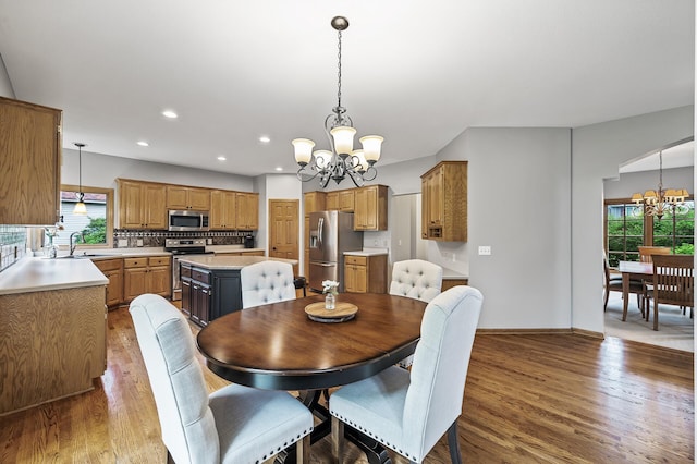 8051 Enclave Bay, Woodbury, MN 55125 - dining area featuring a chandelier, plenty of natural light, wood finished floors, and recessed lighting