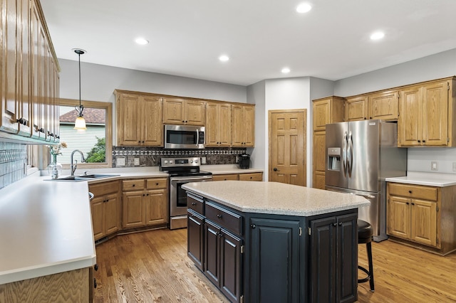 8051 Enclave Bay, Woodbury, MN 55125 - kitchen featuring stainless steel appliances, a kitchen island, backsplash, light wood finished floors, and recessed lighting
