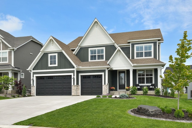 16942 47th Pl N, Plymouth, MN 55446 - craftsman-style home featuring board and batten siding, an attached garage, a shingled roof, a front yard, and concrete driveway