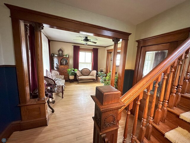 619 University Dr S, Fargo, ND 58103 - entrance foyer with stairway, ceiling fan, light wood-style floors, and ornamental molding