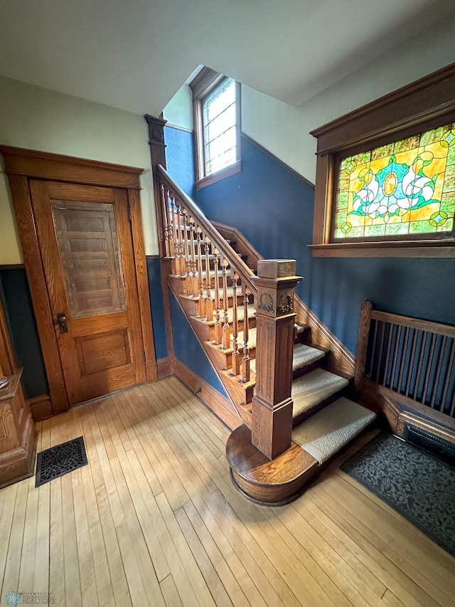 619 University Dr S, Fargo, ND 58103 - stairway featuring hardwood / wood-style floors