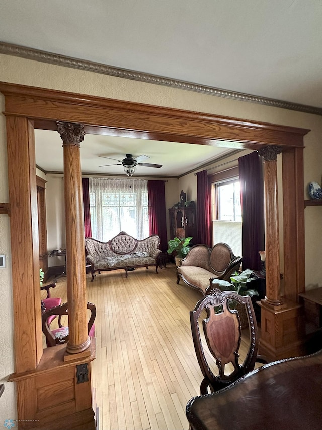 619 University Dr S, Fargo, ND 58103 - living room with ornate columns, plenty of natural light, ornamental molding, hardwood / wood-style flooring, and a ceiling fan