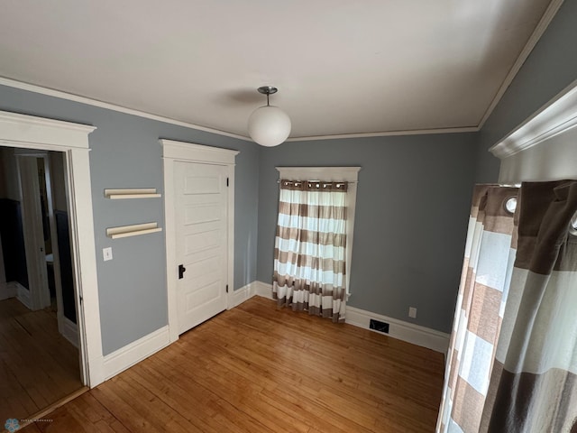 619 University Dr S, Fargo, ND 58103 - unfurnished bedroom featuring wood finished floors and crown molding
