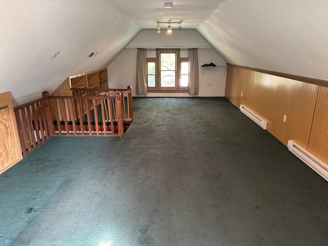 619 University Dr S, Fargo, ND 58103 - bonus room with a baseboard heating unit, lofted ceiling, and carpet floors