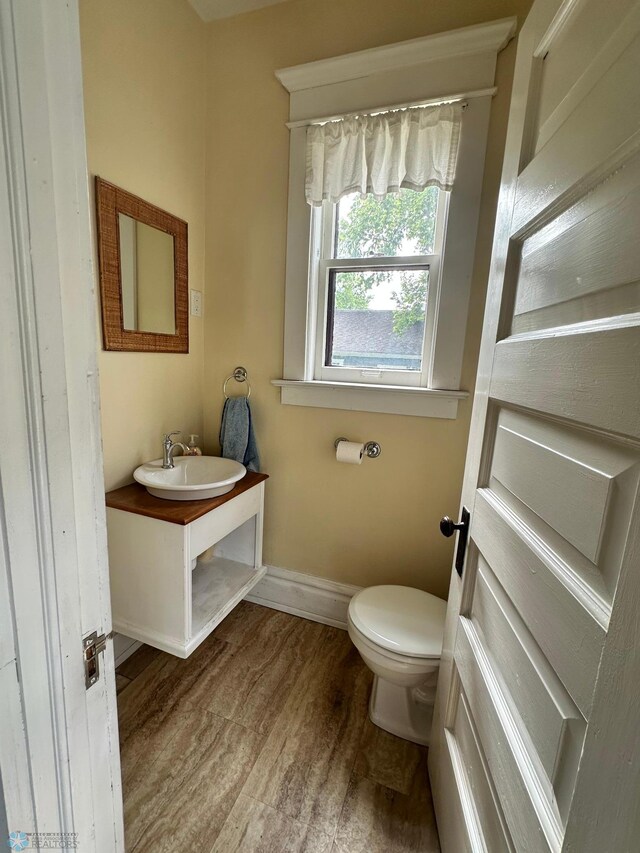 619 University Dr S, Fargo, ND 58103 - bathroom featuring vanity and wood finished floors
