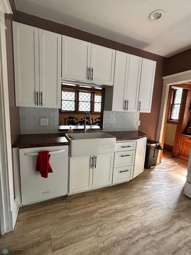 619 University Dr S, Fargo, ND 58103 - kitchen with dishwasher, dark countertops, and tasteful backsplash
